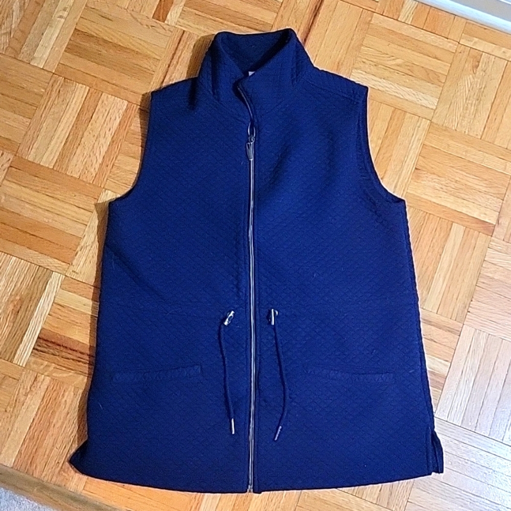 Kim Rogers blue vest.